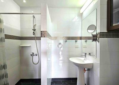 Modern white bathroom with walk-in shower