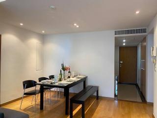 Modern dining area with table set for a meal