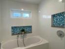 Modern Bathroom with Blue Mosaic Tiles and a Bathtub