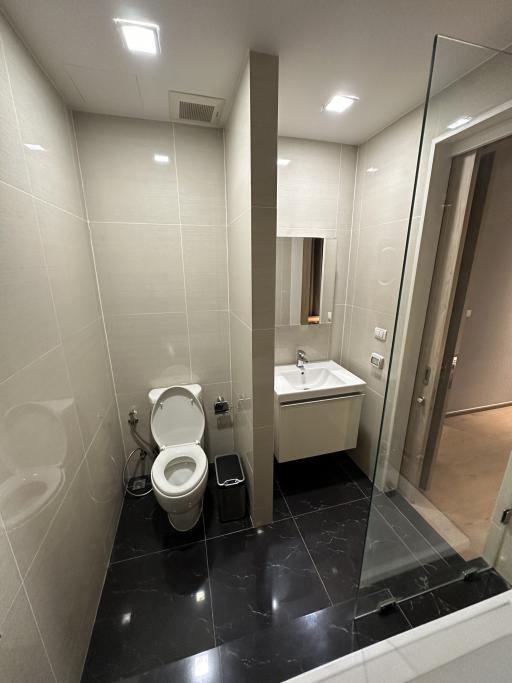 Modern bathroom interior with tiled walls and flooring