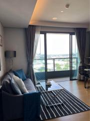 Modern living room with large windows overlooking the city