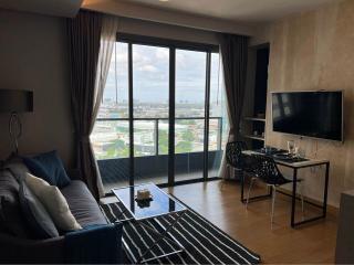 Modern living room with city view through large window