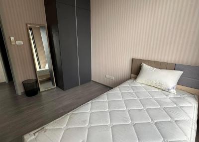 Modern bedroom with large bed and wardrobe