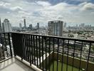 Spacious balcony with city skyline view and safety railing