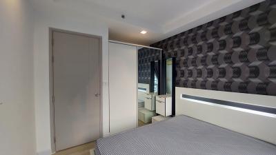 Modern bedroom with stylish wallpaper and ambient lighting