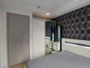 Modern bedroom with stylish wallpaper and ambient lighting