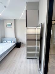 Modern bedroom with queen-size bed and built-in wardrobe