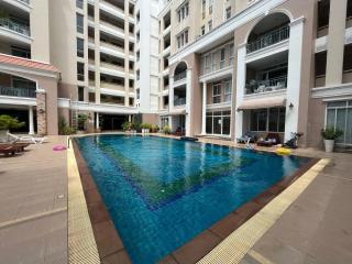 Apartment complex with swimming pool and lounge area