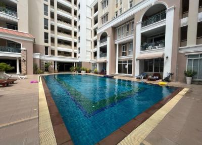 Apartment complex with swimming pool and lounge area