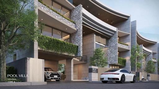 Exterior view of a modern villa with cascading design and natural stone accents, featuring lush greenery and a luxury car parked outside