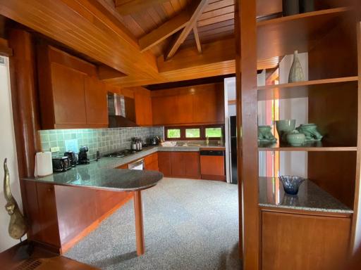Spacious kitchen with wooden cabinets and modern appliances