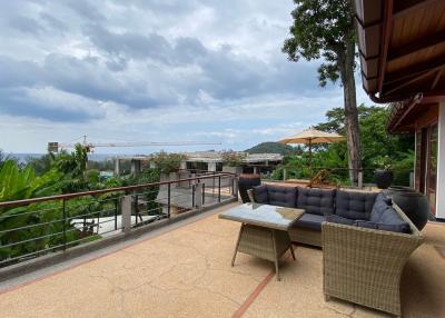 Spacious balcony with comfortable seating and scenic view