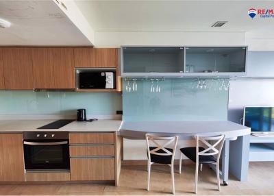 Modern kitchen with integrated appliances and dining area