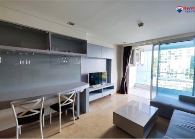 Modern living room with natural light and balcony access