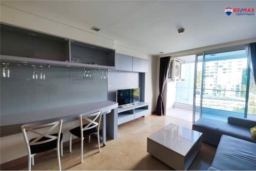 Modern living room with natural light and balcony access