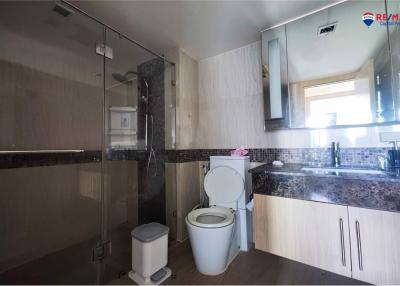 Modern bathroom with shower cabin and toilet