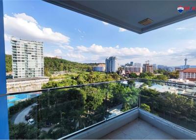 Spacious balcony with a scenic city view and clear blue sky