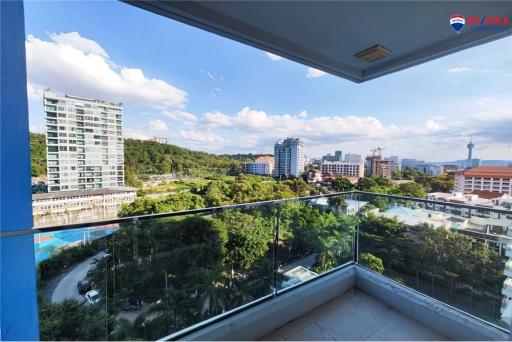 Spacious balcony with a scenic city view and clear blue sky