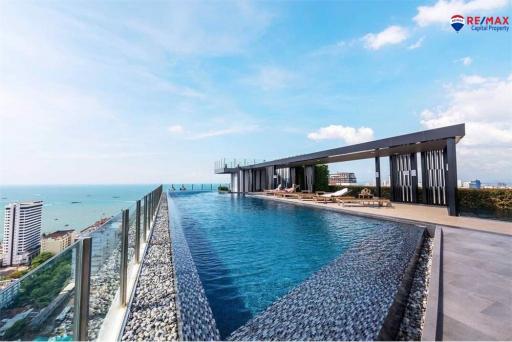 Luxurious rooftop infinity pool with ocean view in modern residential building