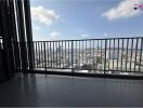 Spacious balcony with city view and safety railing