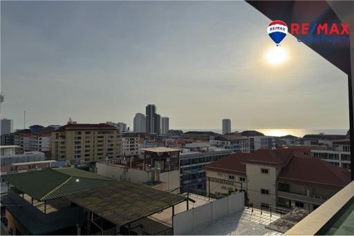 Panoramic city view from balcony at sunset