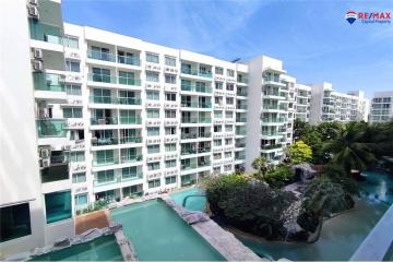 Exterior view of modern apartment buildings with a communal pool