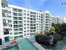 Exterior view of modern apartment buildings with a communal pool