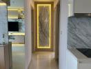 Modern apartment interior hallway with marble accents and integrated lighting