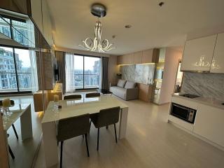 Modern living room with dining area and open kitchen in an apartment