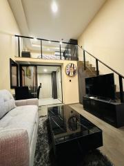 Modern living room interior with staircase and mezzanine