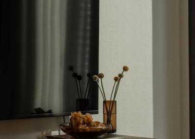 Elegant wooden console table with decorative items in a modern living room