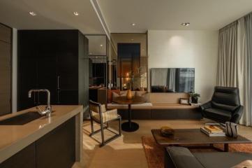 Modern living room with open kitchen design, featuring elegant furniture and sophisticated interior decoration