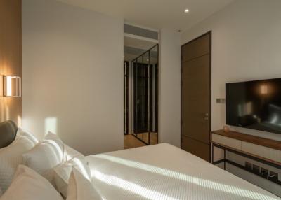 Modern bedroom interior with a comfortable bed and ambient lighting