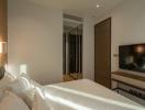 Modern bedroom interior with a comfortable bed and ambient lighting