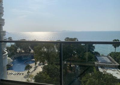 Balcony view with swimming pool and sea horizon