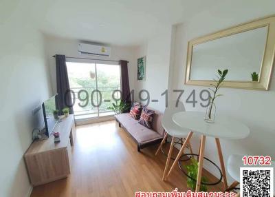 Bright living room with contemporary furniture and large window