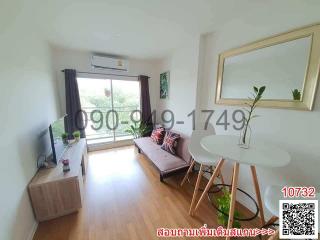 Bright living room with contemporary furniture and large window