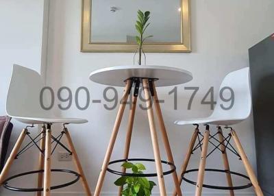 Modern dining space with a round table and designer chairs