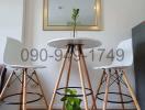 Modern dining space with a round table and designer chairs