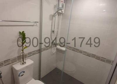 Modern bathroom with glass shower enclosure and white fixtures