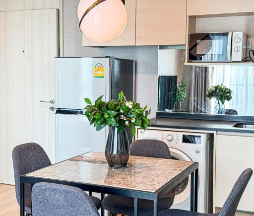 Modern kitchen with dining area and integrated appliances