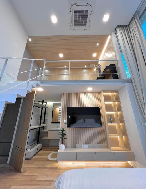 Modern bedroom with mezzanine and built-in wardrobe