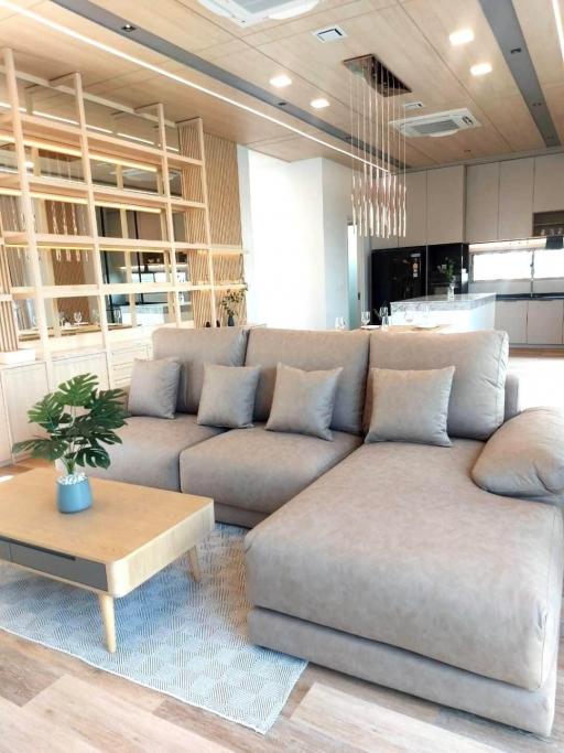 Contemporary living room with a comfortable sectional sofa and open shelving