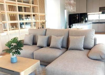 Contemporary living room with a comfortable sectional sofa and open shelving