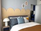 Modern bedroom with stylish headboard and decorative wall hangings