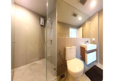Modern bathroom interior with walk-in shower and vanity