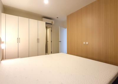 Spacious bedroom with large bed and fitted wardrobes