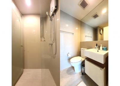 Modern bathroom interior with glass shower, toilet and sink