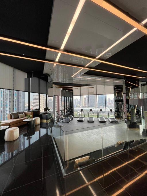 Modern high-rise gym with panoramic city views