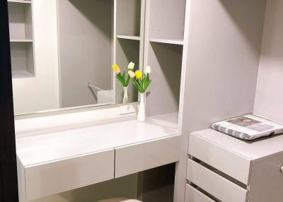 Modern bedroom with built-in closet and makeup vanity